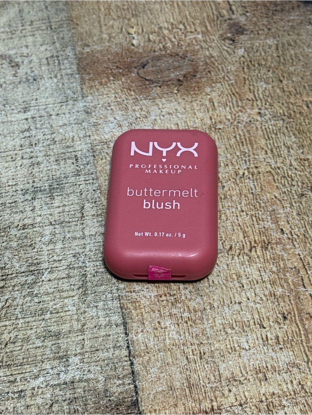 pink compact NYX Professional Makeup Buttermelt Blush with a buttery, high-pigme